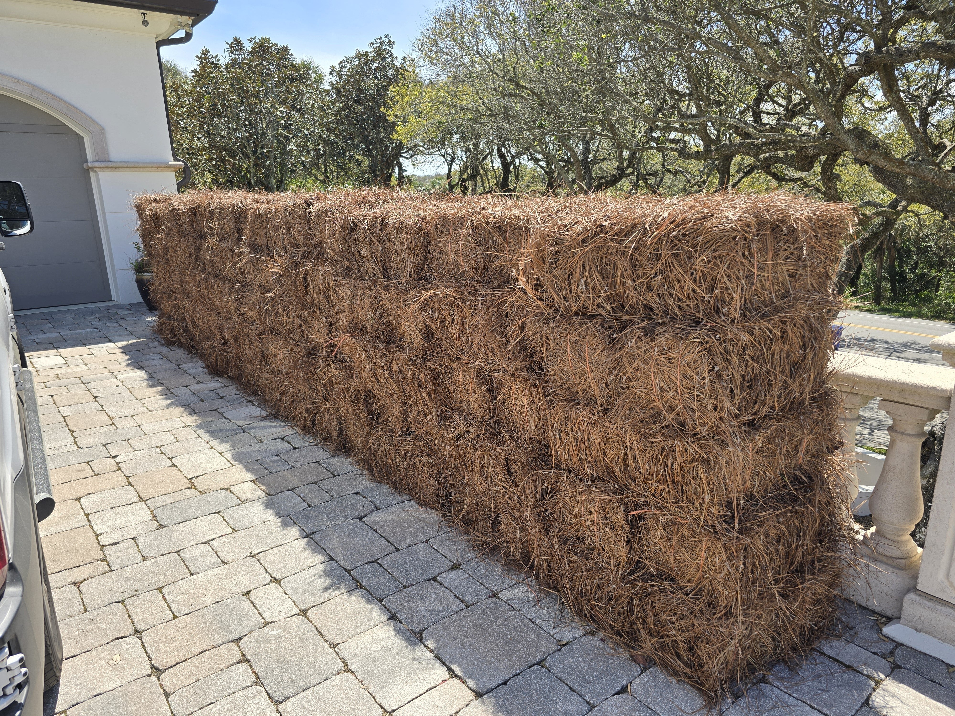 100 bales of premium longleaf pine straw with rich auburn color ready for installation